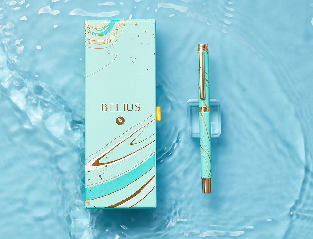 ROLLER BELIUS AQUA ALUMINIO COLOR TURQUESA Y DORADO TINTA NEGRA CAJA DE DISEO